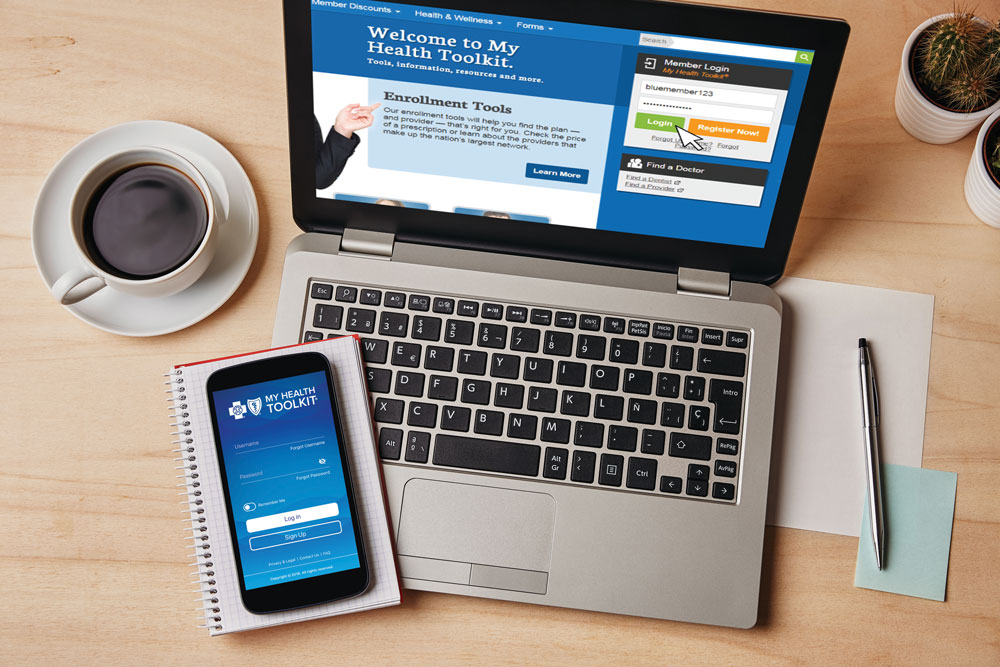 overhead view of computer and phone with my health toolkit open